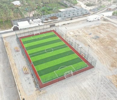 Oman football training field - Green space rising from the desert led stadium light
